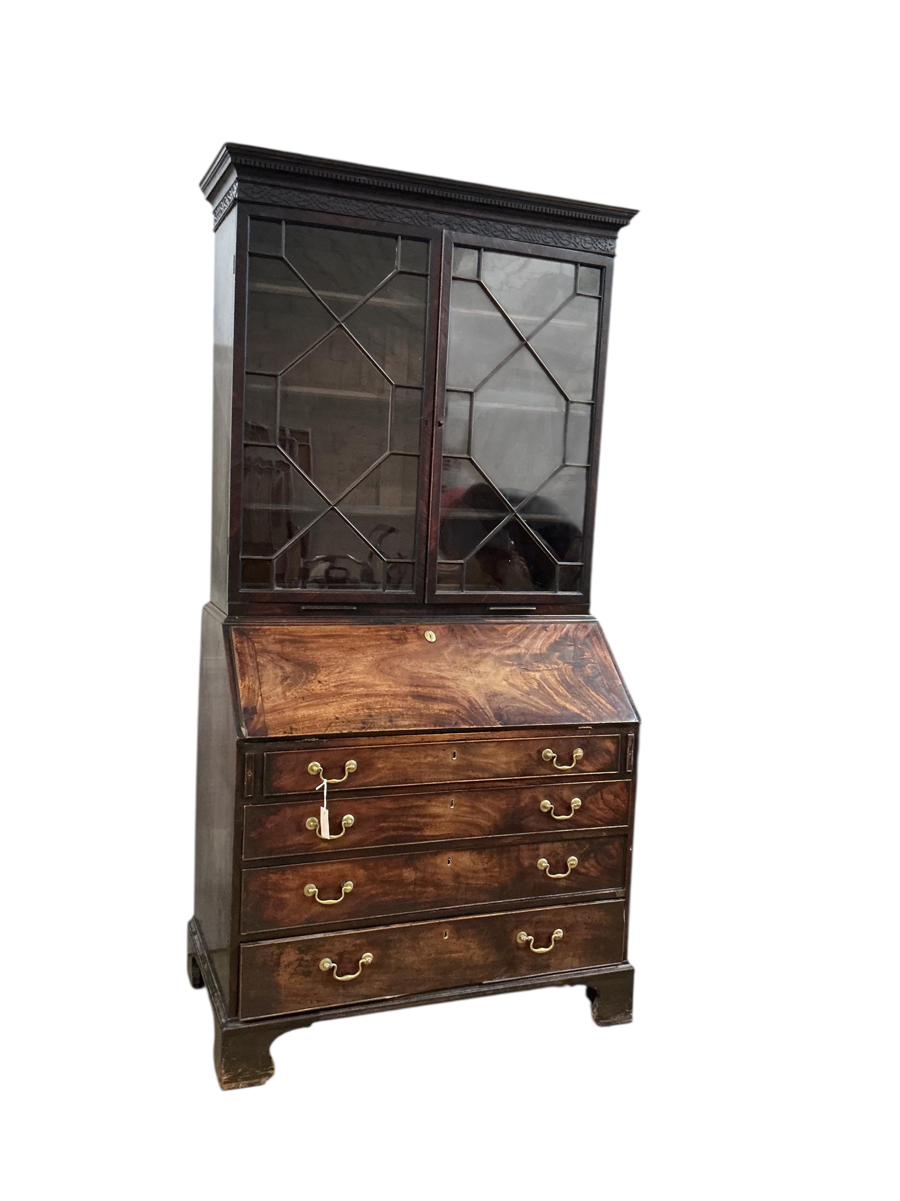 A George III mahogany bureau bookcase, width 112cm, depth 61cm, height 218cm